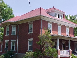 Red brick structure with red shingles