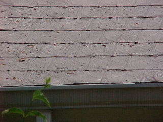Before photo of old tin shingles
